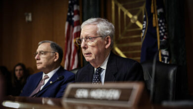 Mitch McConnell using a wheelchair after falling down stairs at the