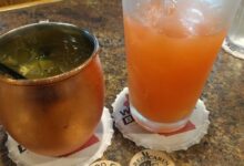 Red cabin on green acres country comforts restaurant with big city tastes